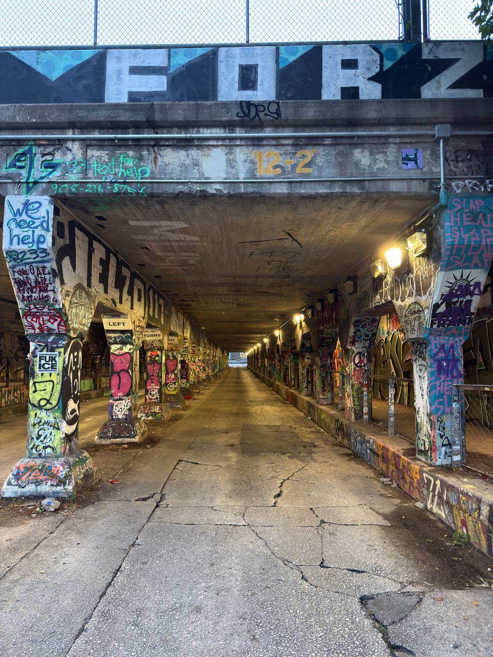 A graffiti-covered concrete underpass